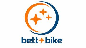 The image shows the logo of "bett + bike". It consists of a circular design with orange and blue elements, as well as three stars.